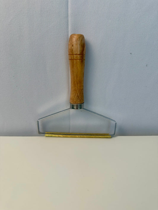 Grattoir pour enlever le poil